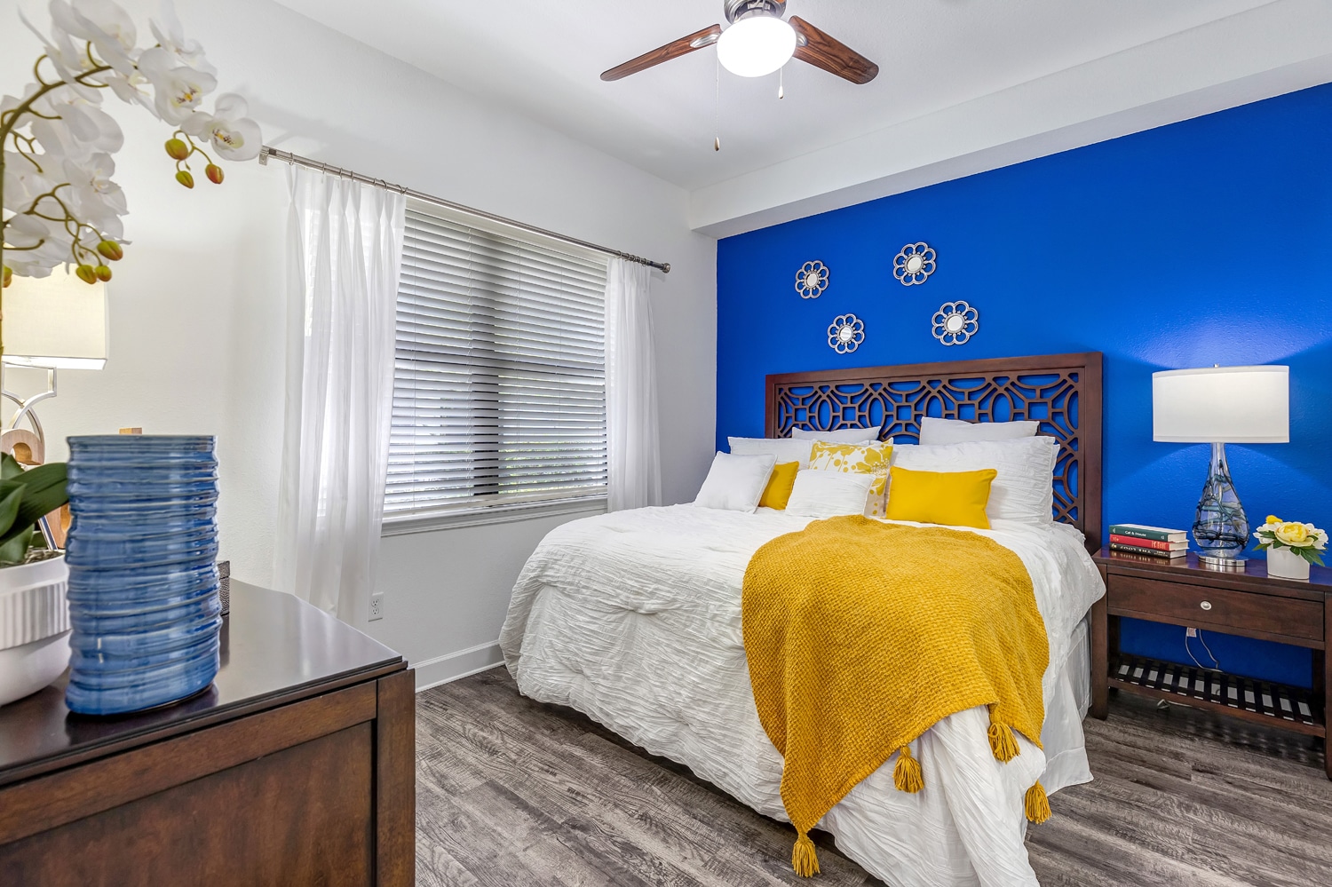 Apartments in Miramar A bedroom with blue walls and white furniture. Miramar Park Apartments